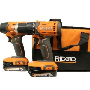 RIDGID DRILL SET WITH TWO BATTERIES CHARGER AND CARRYING CASE
